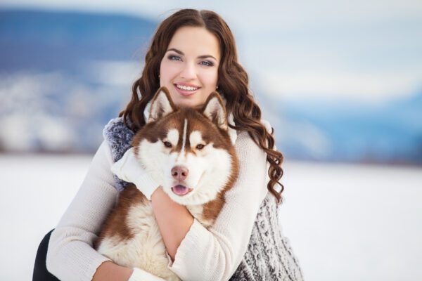 Husky With Woman In Winter Park