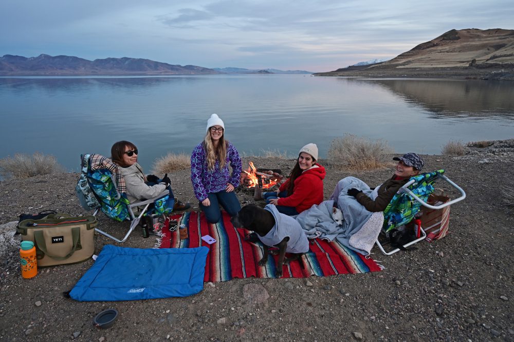 women and dogs picnicking at Pyramid Lake