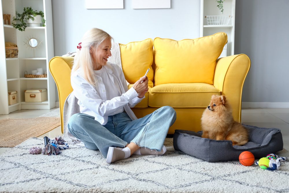 woman photographing dog